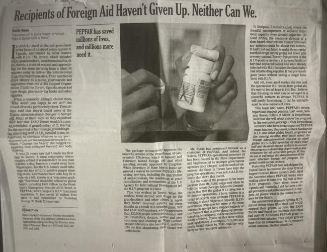 A folded newspaper page carried from the airport